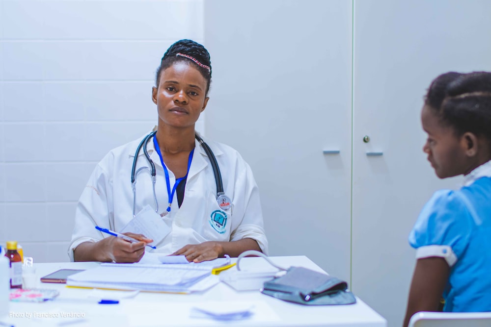 Doctor consulting with a young girl patient
