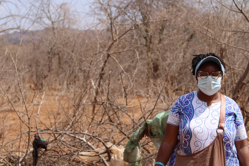 Health worker in protective gear caring for a patient