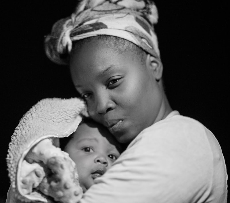 Woman carrying her baby